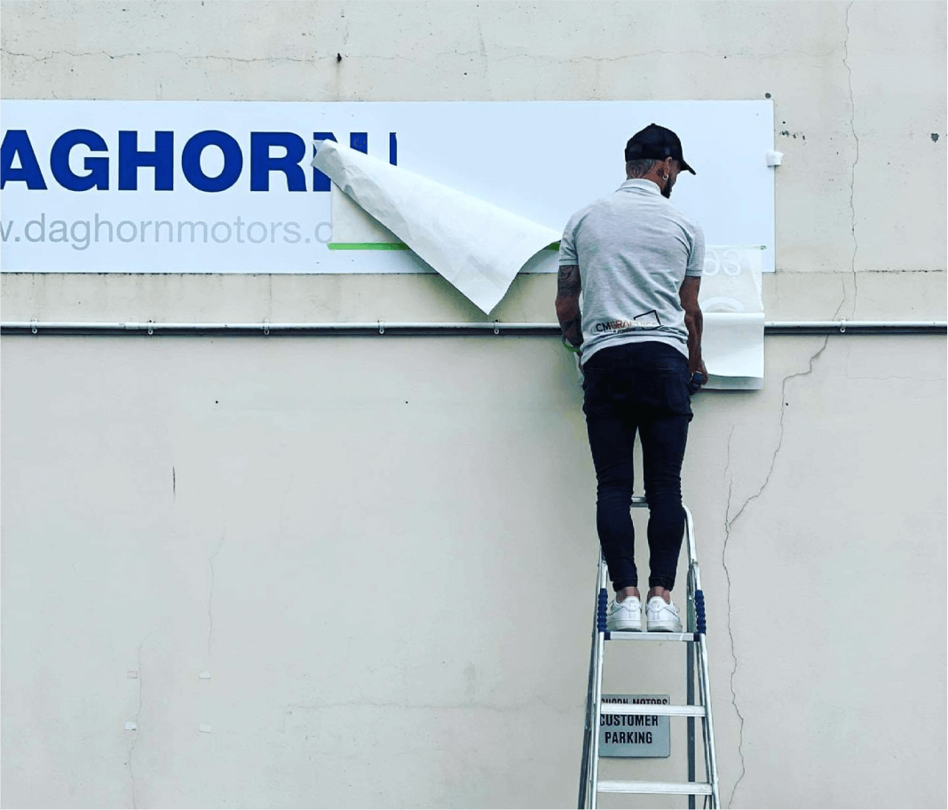 Carlos Creating an Awesome Signage Design